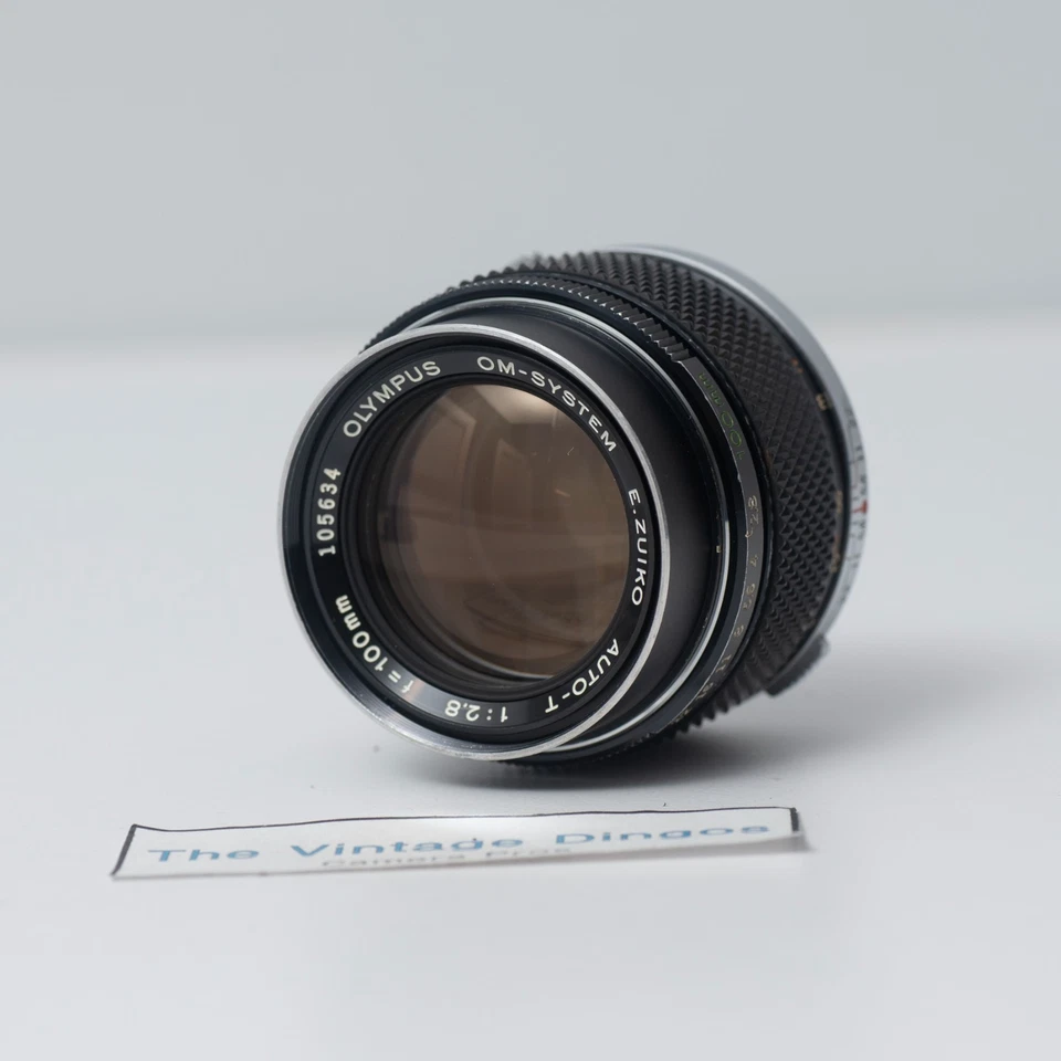Lente Olympus OM-SYSTEM E.Zuiko Auto-T 100 mm f/2,8 MF con tapas + filtro Foto 2 de 4