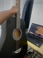 Black acoustic guitar 18frets full sizes comes with strap and bag barely used