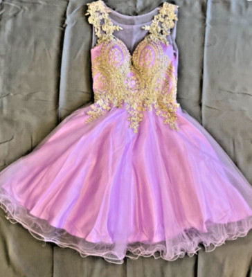 Light purple dress.  From May Queen.  Gold floral designs. Excellent conditions.