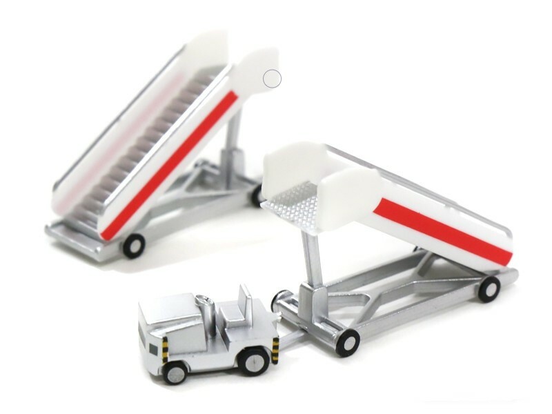 Herpa SCENIX SERIES Airport passenger stairs with tractor 1
