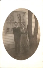 Early 1900s Postcard RPPC Couple Outside House Leg O Mutton Sleeves Divided Back