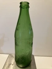 MOUNTAIN DEW It’ll tickle your innards! 10 Oz NO DEPOSIT RETURN Textured Bottle