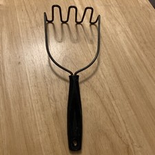 vintage kitchen potato masher with black nylo...