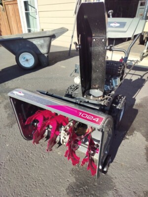 2-stage Briggs and Stratton Red and Grey  Model 1024 gas snow blower