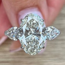4.05 TCW Oval Cut Moissanite Three Stone Engagement Ring 14k White Gold Plated