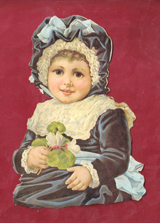 Very Rare Chromo Cutout Beautiful Baby Girl In Blue Outfit With Small Flower.