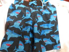 Toddler size XS blsck, blue and red swim trunks with shark design by Cat  Jack