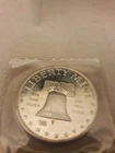 1986 LIBERTY MINT, BELL, SILVER 1 TROY OZ. .999, ROUND