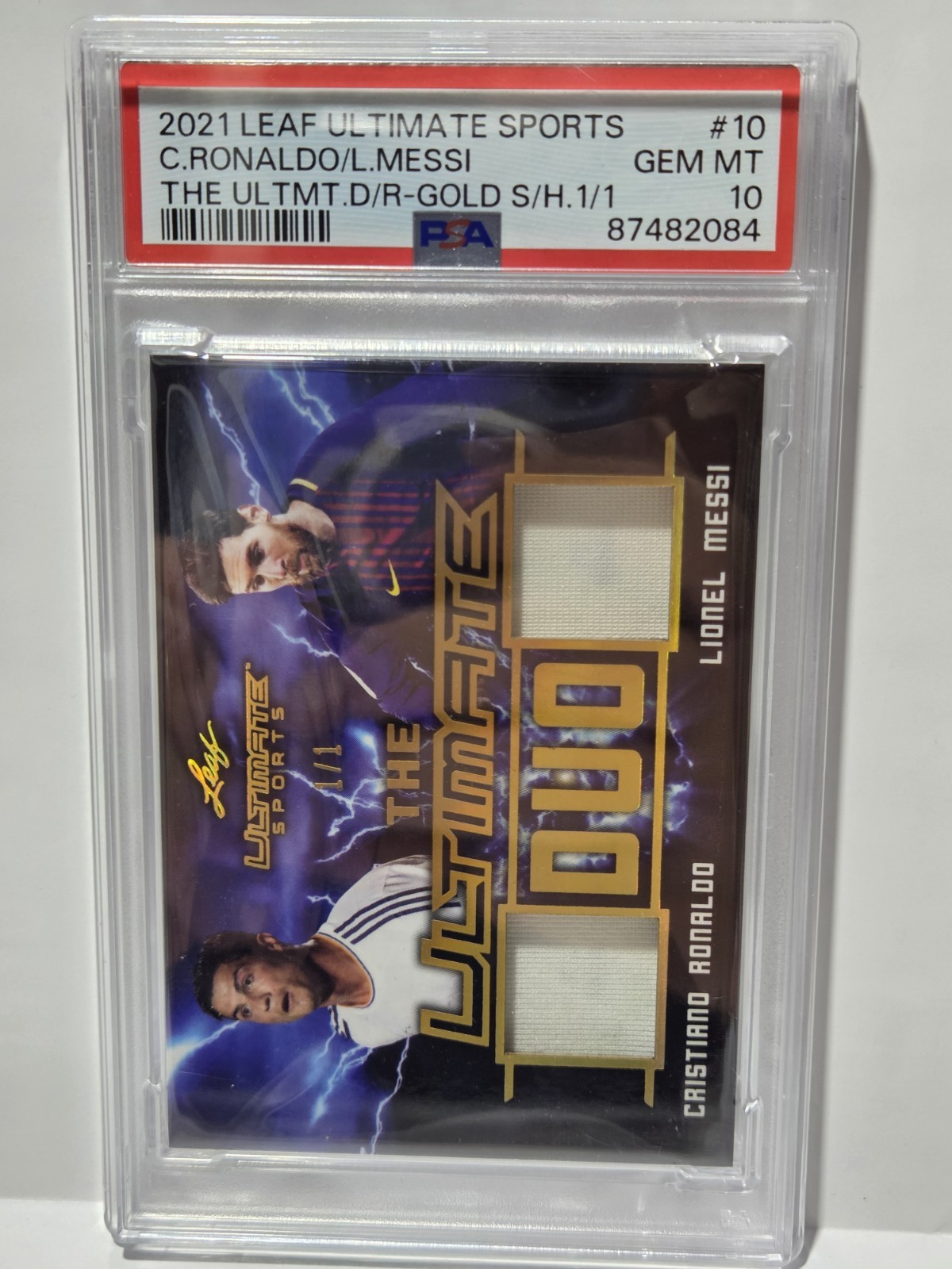 2021 Leaf Ultimate Cristiano Ronaldo Lionel Messi Game Worn Material 1/1 PSA 10 view 2