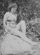 Pretty Woman Vintage Floral Swimsuit Relaxing on Rock 1940s