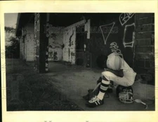 1992 Press Photo Damian Thompson, young football player, waits for game to begin