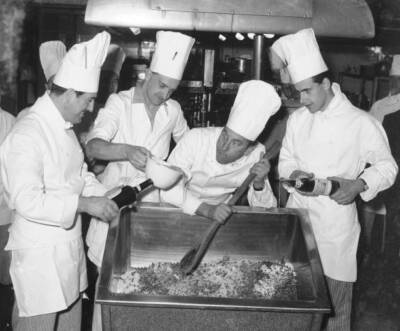 Comedian Frankie Howerd seen here giving the chefs of an unn- 1957 Old Photo