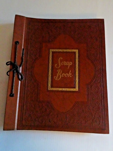 Vintage scrapbook of heavy cardboard and paper with 2-hole cord tie, 33 pages.