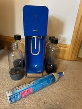 Sodastream blue with half full gas cannister plus full cannister and 4 bottles