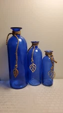 Set Of  3  Blue Bottles  6.5 8.5 And 10 .5 In. Tall  Good Condition