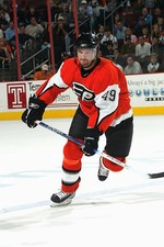 Brian Savage Philadelphia Flyers skates at the NHL game with- Ice Hockey Photo 1