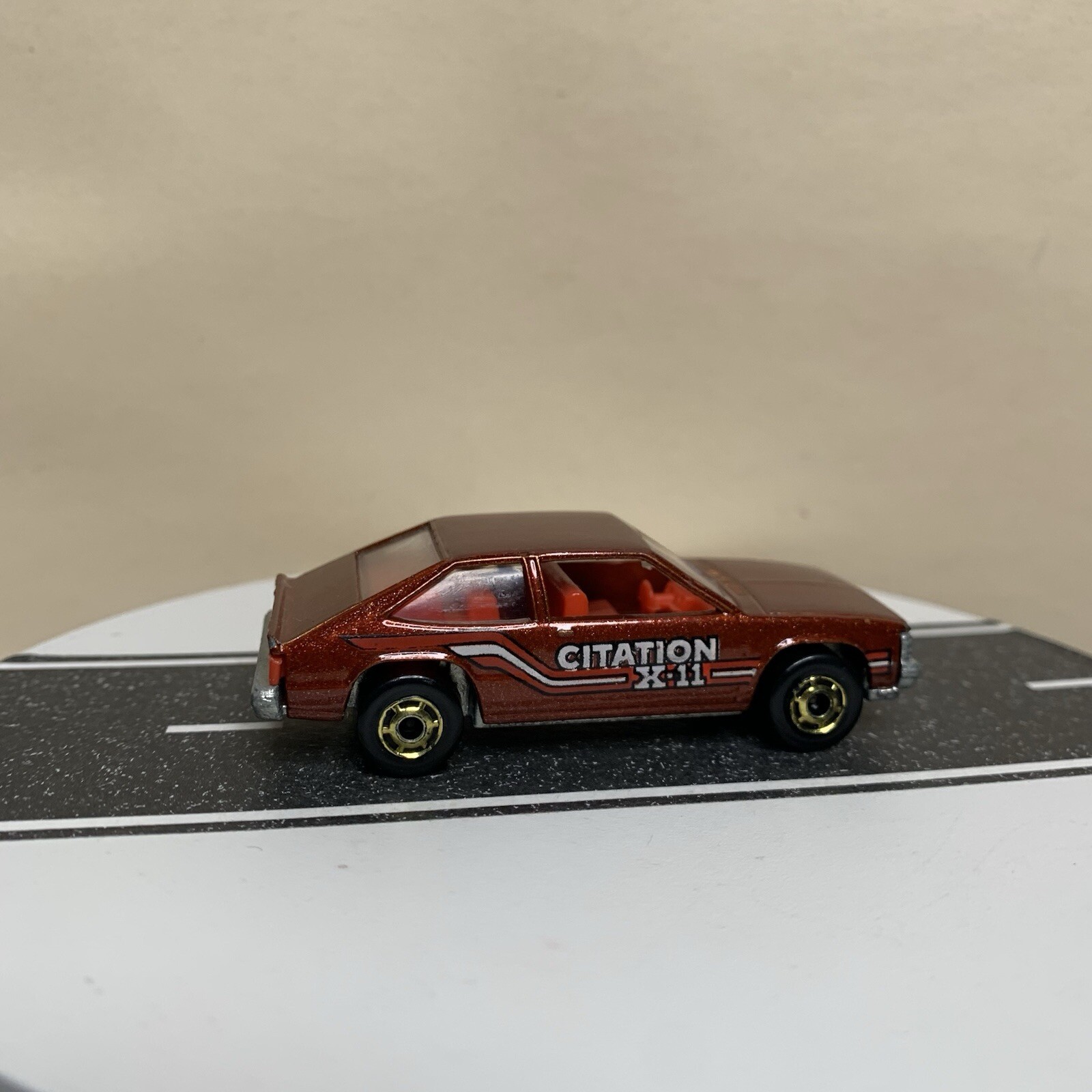 Chevrolet Citation X-11 1980 Hot Wheels marrón con GHO dorado HO y base Malasia en muy buena condición