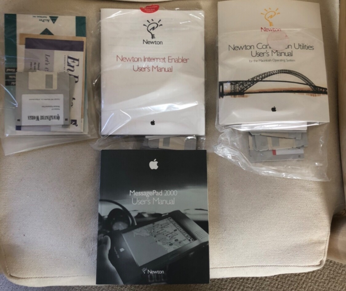 Newton/ Apple MessagePad 2000 with plug-in boards, battery, and