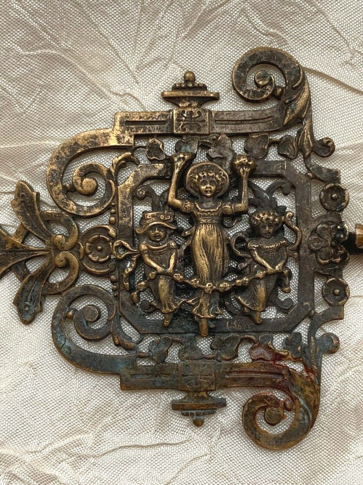 Antique Brass Buckle with three girls holding a rope covered with
