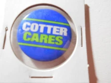 1-1/4" Cotter Cares unknown location and office cello pinback button