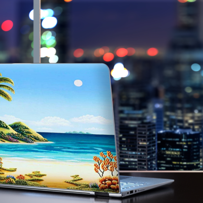Premium Photo | A laptop on a beach with a palm tree in the background
