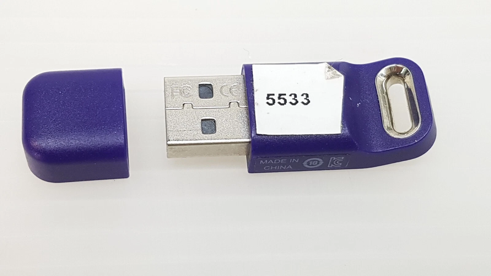 SA-10030600 USB key with cap removed showing the USB-A plug with FC and CE marks