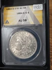 1884-O/O $1 Morgan Silver Dollar ANACS AU 58