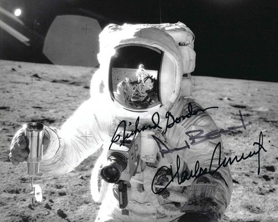 APOLLO 12 CREW SIGNED PHOTOGRAPH OF BEAN ON THE MOON HOLDING A SOIL CONTAINER