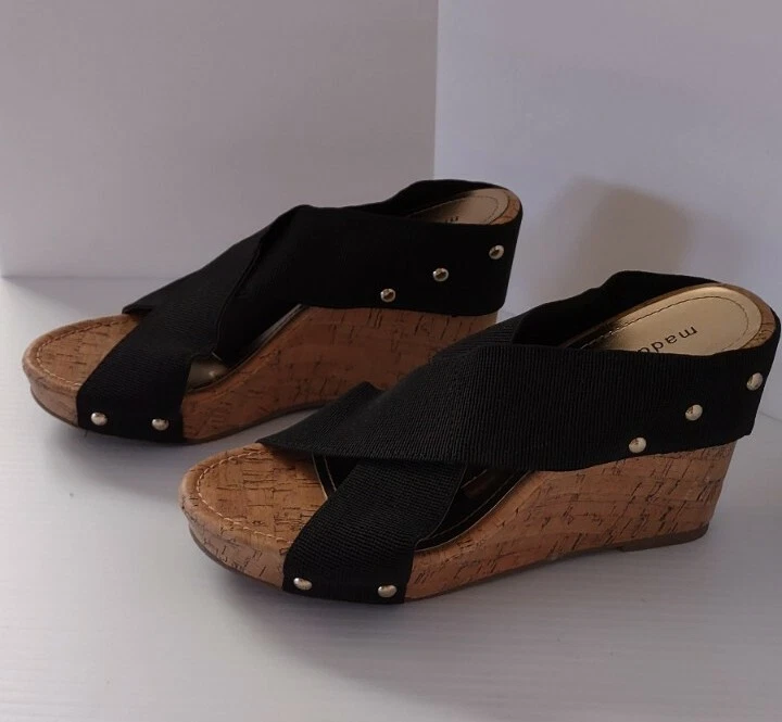 Little girl deals black wedges