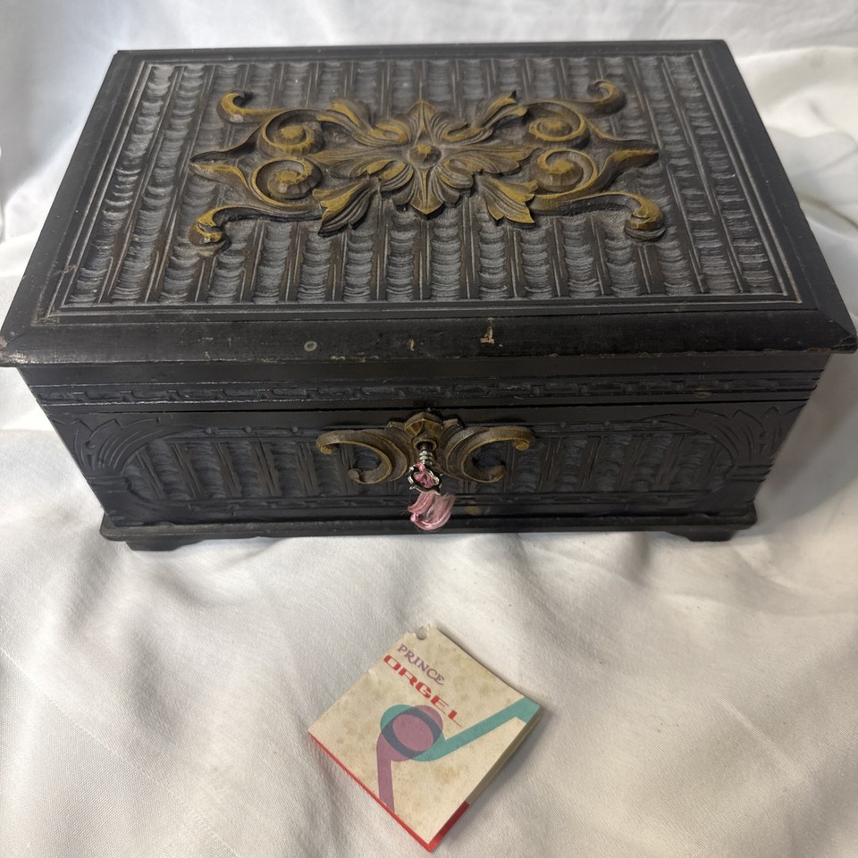 Hand-carved Japanese wooden jewelry box with a lock and key playing 'Maiden Prayer' — the kind of piece that gets passed down generations.