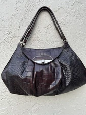 Furla crocodile-embossed leather handbag in a dark brown or black color