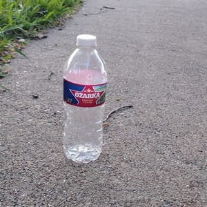 Empty Ozarka Natural Spring Still Bottled Water.