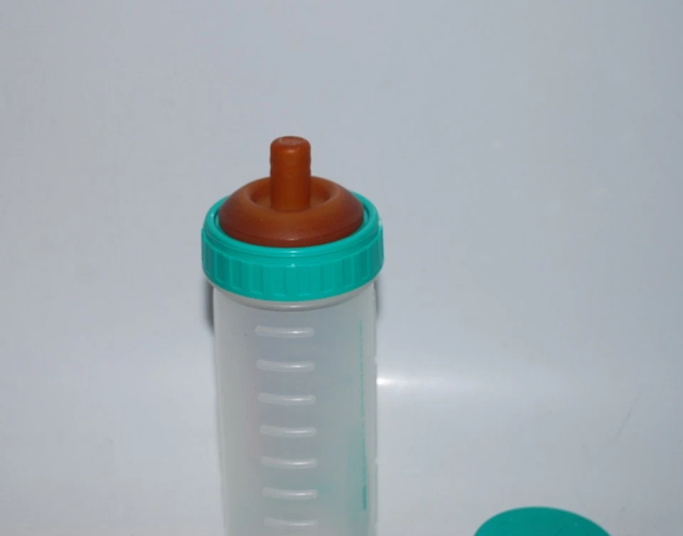 Biberón Playtex Green 1997 vintage para enfermera con anillo, tapa y pezón plano Foto 2 de 3