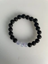 Black lava Bead Bracelet With 3 Neutral Coloured Glass Beads