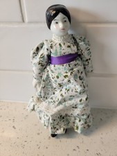vintage 7.5" china head doll with cloth body,porcelain head,hands,and feet