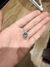 Enchanted Disney Aladdin Oval Swiss Blue Topaz and Diamond Frame Pendant