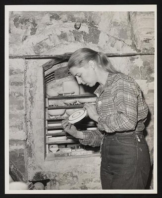 #ad Carol Janeway cerarmist checks plate before putting in the kiln to bake $9.99