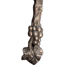 Michael Aram Bread Knife. Beautiful silver grapes and leaves on base of knife.