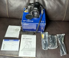 Olympus SP-565UZ 10MP Digital Camera W/ 20x Optical Zoom Works W/ Box  Manuals