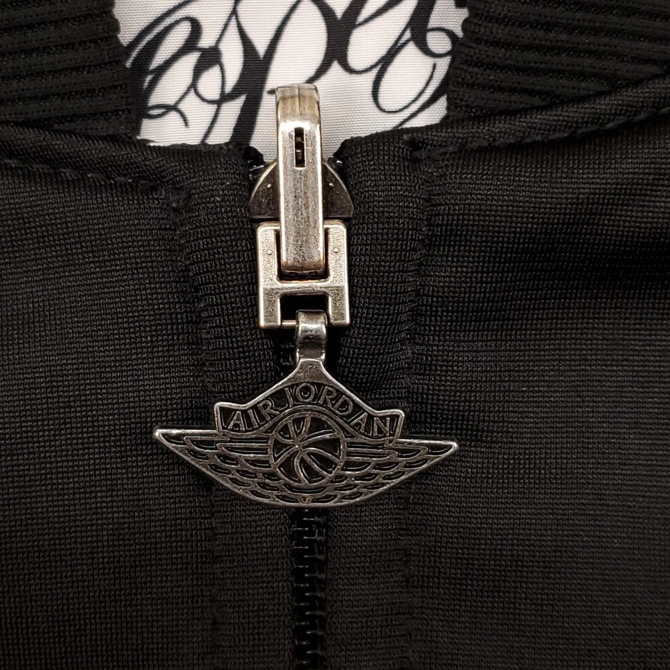 Jaqueta masculina reversível Air Jordan grande preta amarela 1985 Flight Club 217869-010 - Imagem 4 de 4