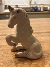 Vintage Iridescent White Porcelain Sitting Unicorn Figurine