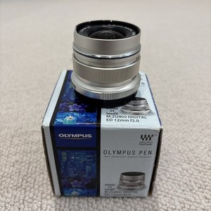 Olympus M.Zuiko 12mm F/2.0 ED Digital Lens, cosmetic damage.