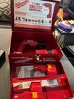 MILWAUKEE 12V HI-TORQUE DRIVER/DRILL WITH BATTERIES, CHARGER AND METAL TOOL CASE — photo 1