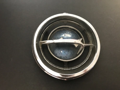 1966 Plymouth Barracuda Grille Emblem 2582427 has ALL TABS
