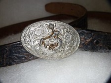 Vintage Bucking Bronco Belt Buckle with its original hand-tooled leather Belt