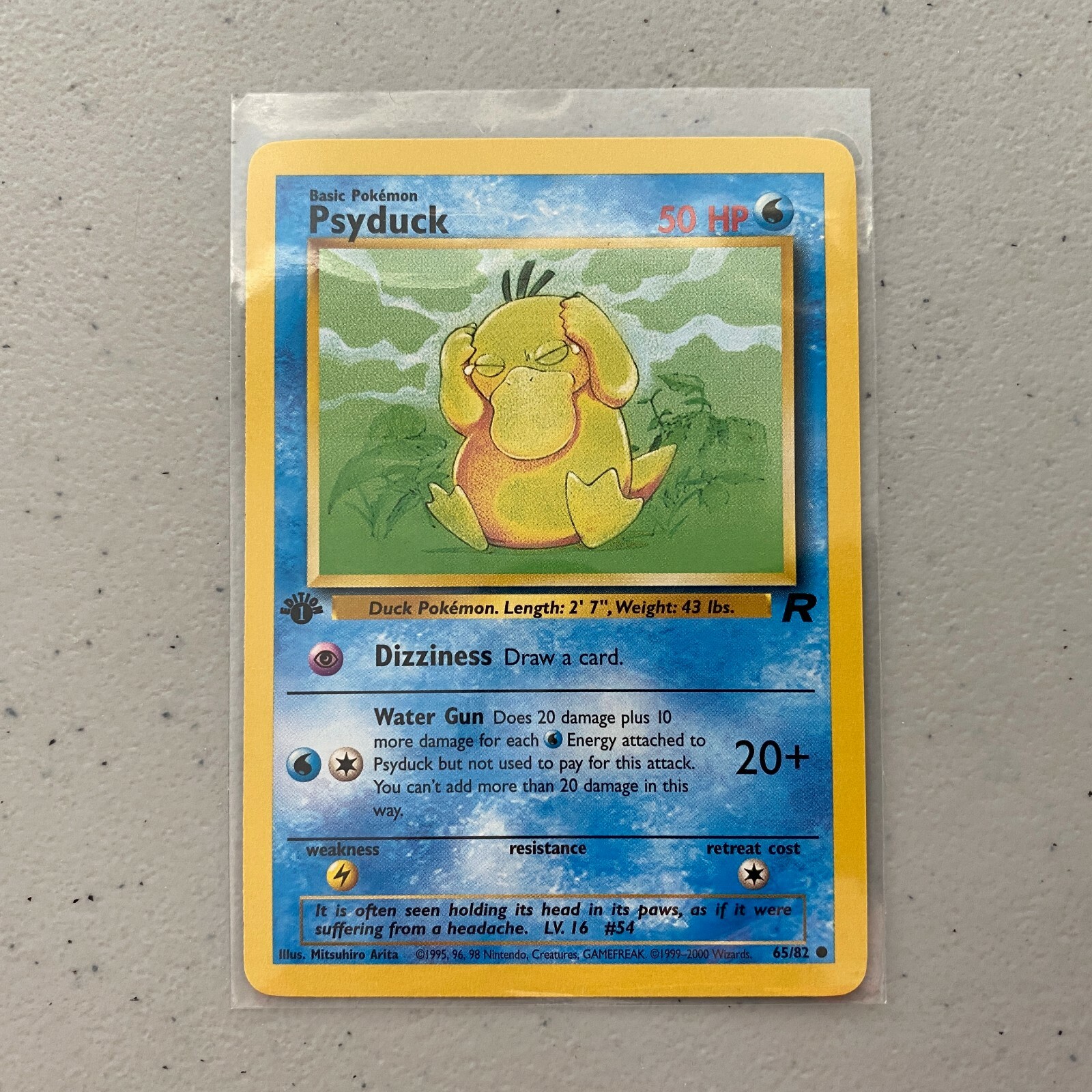 Psyduck 1st Edition 65/82 Team Rocket Pokemon Card Common Mint