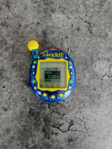TAMAGOTCHI BANDAI V2 2004 connection jaune yellow flowers / testé ok