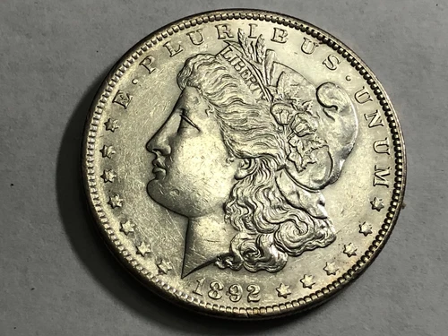 1892 Morgan silver dollar. AU-UNC slider, dipped or lightly cleaned. #ned2