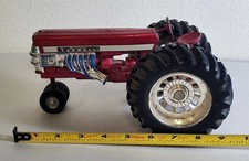 E-581 VINTAGE ERTL MCCORMICK FARMALL FLY'N FARMALL PULLING RED TOY TRACTOR!