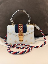 Authentic Gucci Sylvie Mini Top Handle Bag, Cream leather metallic gold bee star